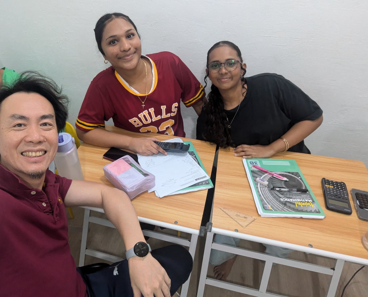 Mr Ng, founder of Mathmatico, with students